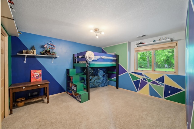 1665 3rd St SW, New Brighton, MN 55112 - bedroom with a textured ceiling, carpet, and baseboards
