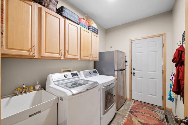 1665 3rd St SW, New Brighton, MN 55112 - laundry room featuring washer and dryer, cabinet space, and baseboards