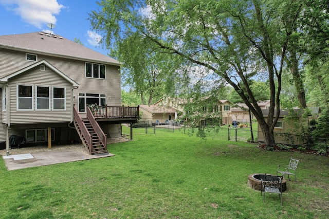 1665 3rd St SW, New Brighton, MN 55112 - view of yard featuring stairway, a deck, a fire pit, and a patio