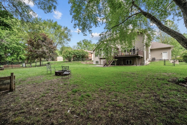 1665 3rd St SW, New Brighton, MN 55112 - view of yard with stairs, a deck, and a fire pit