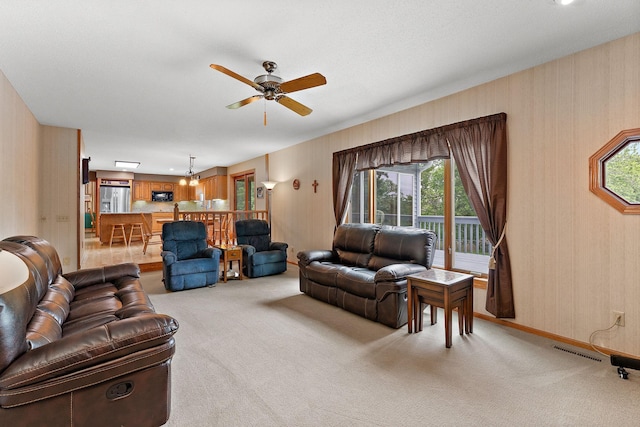 2501 112th St, Bloomington, MN 55431 - living area with light carpet, healthy amount of natural light, and a ceiling fan