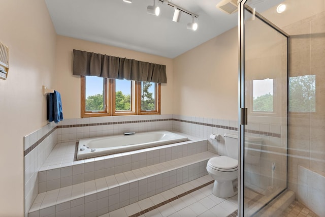 2501 112th St, Bloomington, MN 55431 - full bath with tile patterned flooring, a stall shower, a bath, lofted ceiling, and toilet
