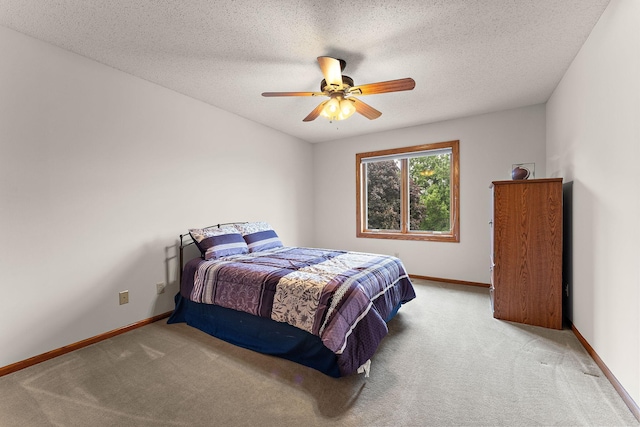 2501 112th St, Bloomington, MN 55431 - carpeted bedroom with baseboards, a textured ceiling, and a ceiling fan