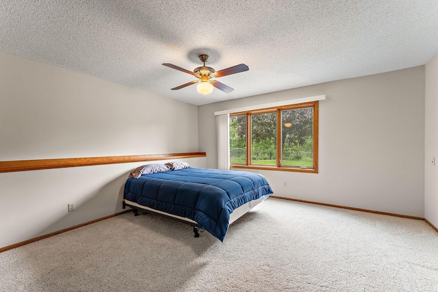 2501 112th St, Bloomington, MN 55431 - carpeted bedroom with baseboards, a ceiling fan, and a textured ceiling