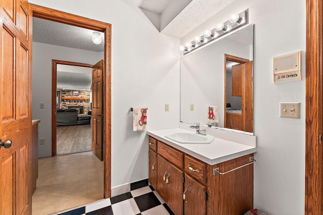2501 112th St, Bloomington, MN 55431 - bathroom featuring vanity, a textured ceiling, and connected bathroom