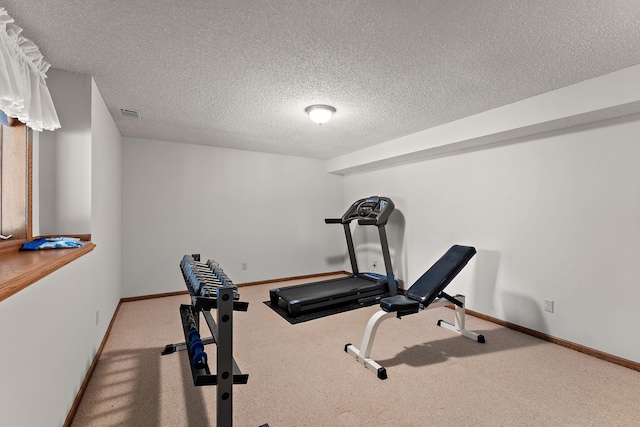 2501 112th St, Bloomington, MN 55431 - workout area featuring carpet flooring, a textured ceiling, and baseboards