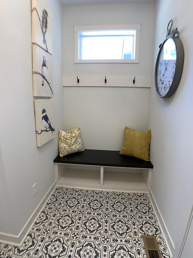 4605 130th Ln NE, Blaine, MN 55449 - mudroom featuring baseboards