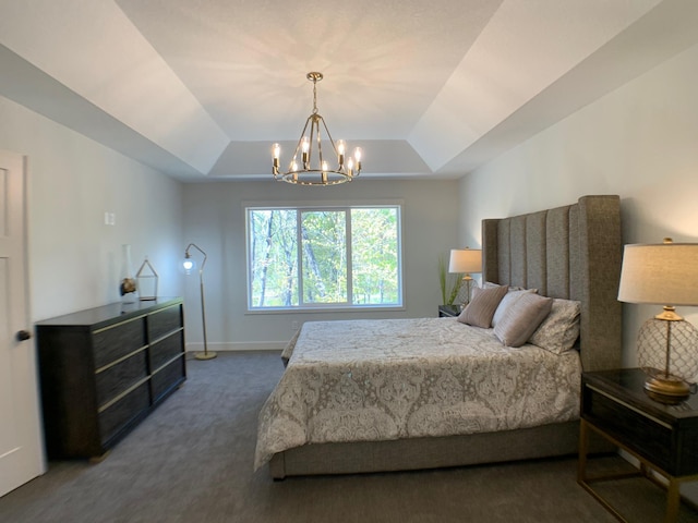 4605 130th Ln NE, Blaine, MN 55449 - bedroom featuring a tray ceiling, dark colored carpet, a chandelier, and baseboards