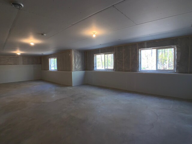 4605 130th Ln NE, Blaine, MN 55449 - spare room featuring concrete floors