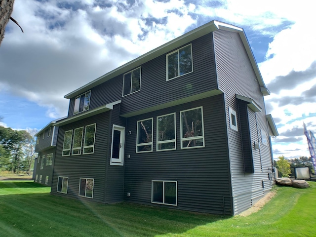 4605 130th Ln NE, Blaine, MN 55449 - back of house featuring a lawn