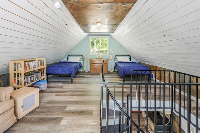 23873 Arcade Loop, Crow Wing Lake Twp, MN 56464 - bedroom featuring wood finished floors, vaulted ceiling, and wood walls