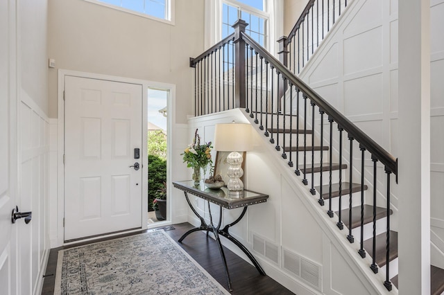 2940 Tiflawn Ct, Shakopee, MN 55379 - foyer featuring a towering ceiling, a decorative wall, stairs, and dark wood-style floors