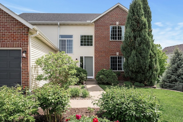 2940 Tiflawn Ct, Shakopee, MN 55379 - view of front facade with brick siding, an attached garage, and a front yard
