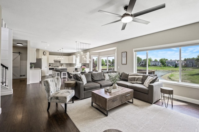 2940 Tiflawn Ct, Shakopee, MN 55379 - living room featuring wood finished floors, ceiling fan, baseboards, recessed lighting, and stairway