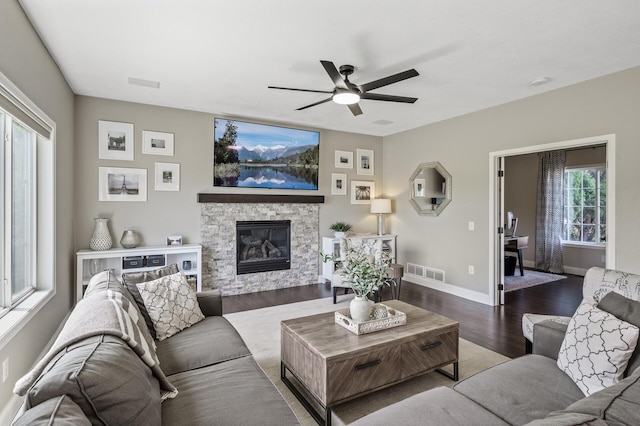 2940 Tiflawn Ct, Shakopee, MN 55379 - living room featuring a ceiling fan, wood finished floors, baseboards, and a stone fireplace