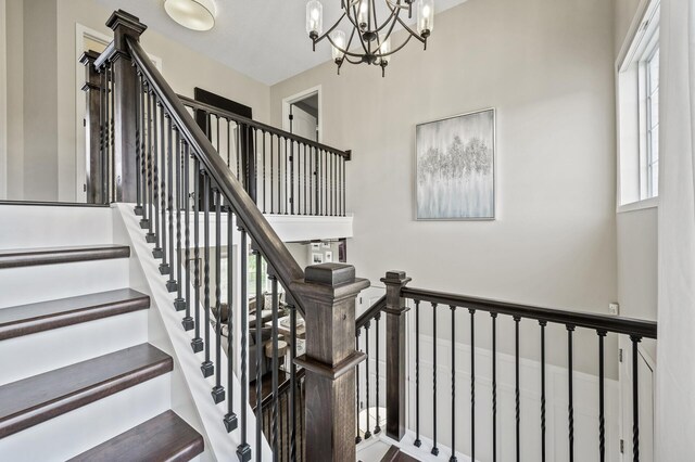 2940 Tiflawn Ct, Shakopee, MN 55379 - stairs with a chandelier