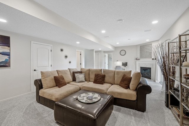 2940 Tiflawn Ct, Shakopee, MN 55379 - living room featuring carpet flooring, recessed lighting, a textured ceiling, a glass covered fireplace, and baseboards