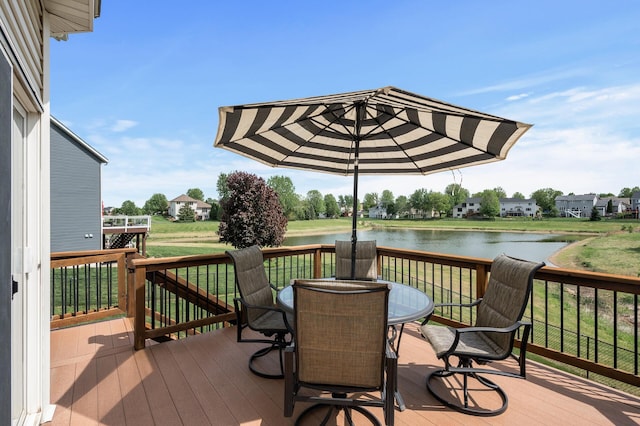 2940 Tiflawn Ct, Shakopee, MN 55379 - deck with a water view, outdoor dining area, and a lawn