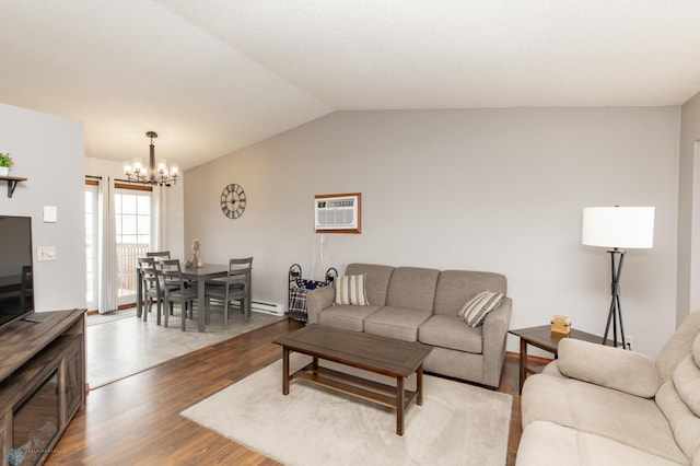 living area with a chandelier, dark wood-type flooring, an AC wall unit, and lofted ceiling
