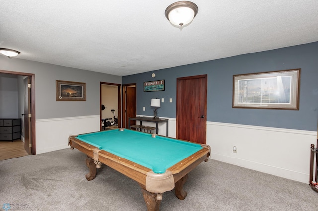 rec room featuring carpet, pool table, and a textured ceiling