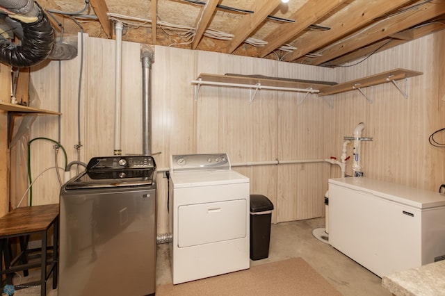 laundry room with washing machine and clothes dryer