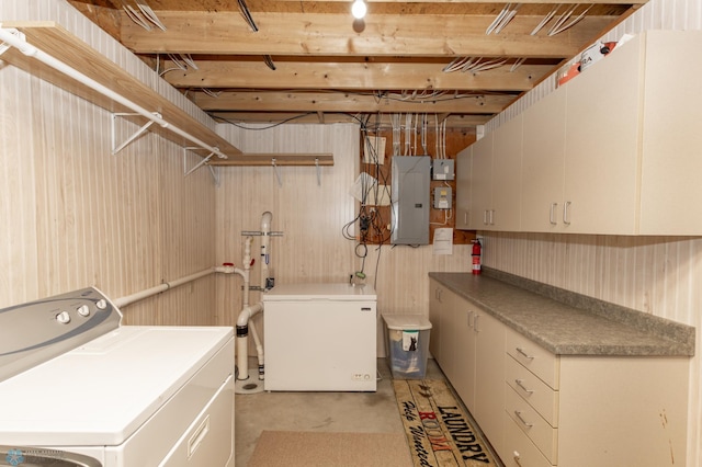 washroom with cabinet space, electric panel, and independent washer and dryer