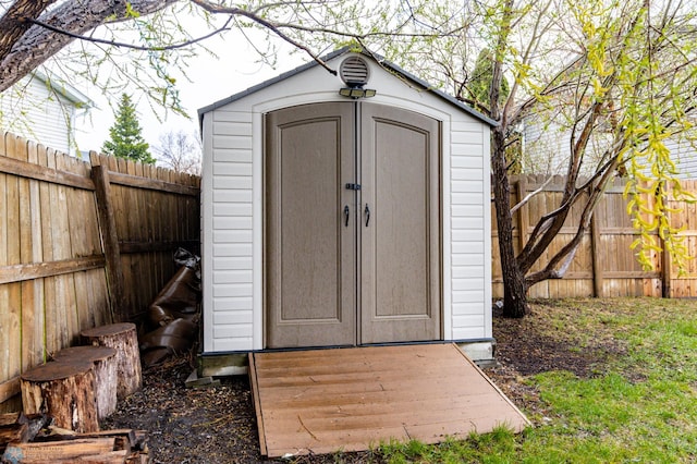 view of shed featuring a fenced backyard