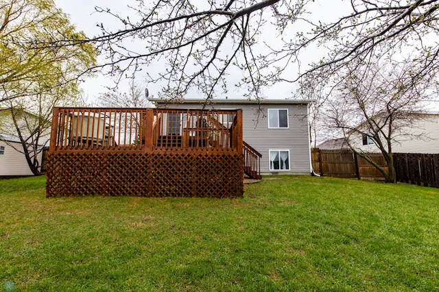 back of house featuring a wooden deck and stairway