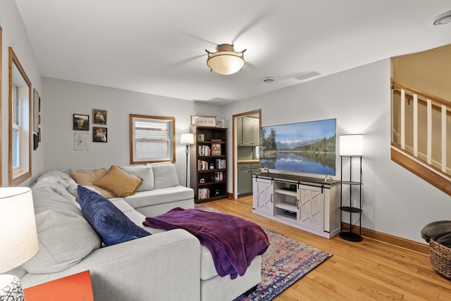 4236 Salem Ave, Saint Louis Park, MN 55416 - living area featuring light wood-style floors, baseboards, and stairs
