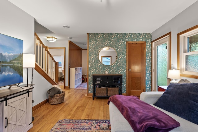 4236 Salem Ave, Saint Louis Park, MN 55416 - living area with wallpapered walls, light wood-style floors, stairs, and baseboards