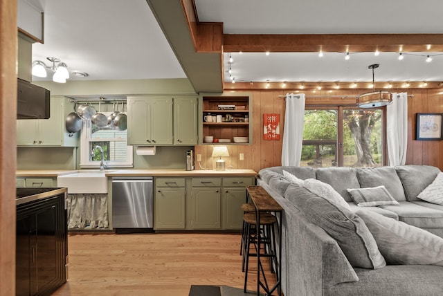 4236 Salem Ave, Saint Louis Park, MN 55416 - kitchen with stainless steel dishwasher, green cabinets, a sink, open floor plan, and light wood-type flooring
