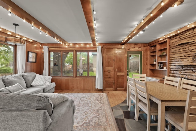 4236 Salem Ave, Saint Louis Park, MN 55416 - living room with track lighting, wood finished floors, wooden walls, beam ceiling, and built in features