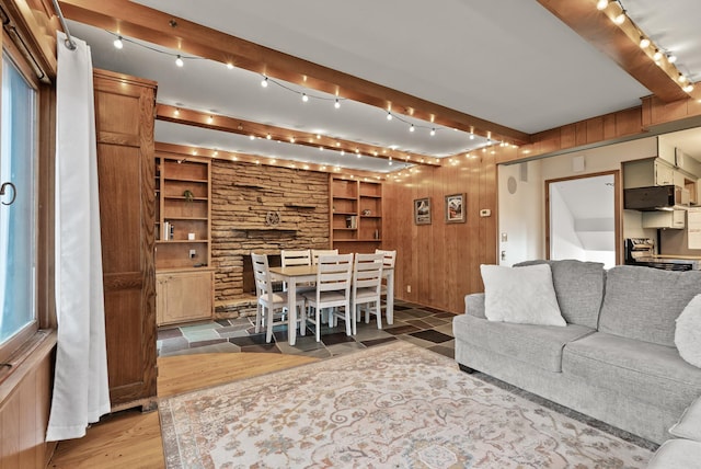 4236 Salem Ave, Saint Louis Park, MN 55416 - living area with rail lighting, beamed ceiling, wood finished floors, wood walls, and built in shelves