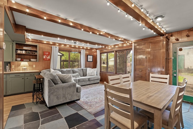 4236 Salem Ave, Saint Louis Park, MN 55416 - living room with wood walls, beamed ceiling, rail lighting, and light flooring