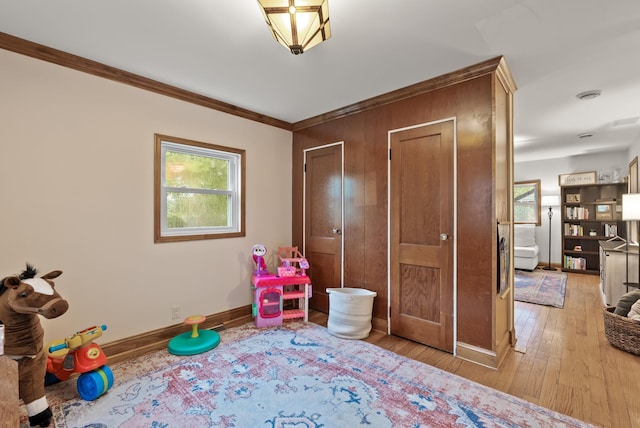 4236 Salem Ave, Saint Louis Park, MN 55416 - playroom featuring baseboards, hardwood / wood-style floors, and crown molding
