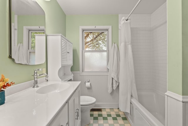4236 Salem Ave, Saint Louis Park, MN 55416 - full bath with wainscoting, toilet, vanity, plenty of natural light, and shower / bath combo with shower curtain