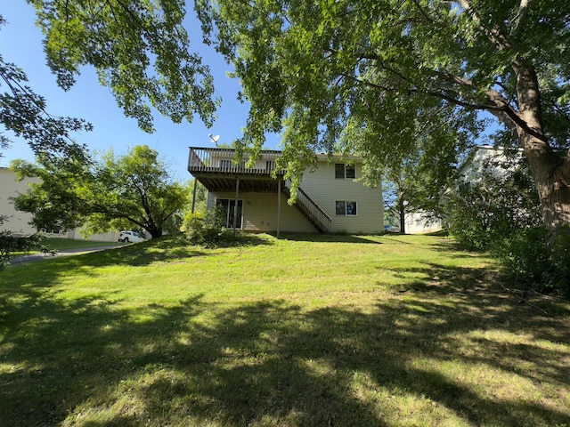 9013 91st St S, Cottage Grove, MN 55016 - view of grassy yard featuring stairway and a wooden deck