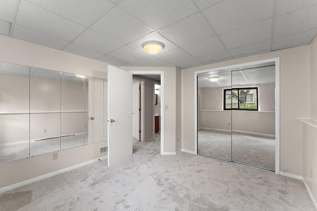 9013 91st St S, Cottage Grove, MN 55016 - unfurnished bedroom with carpet, a paneled ceiling, and a closet