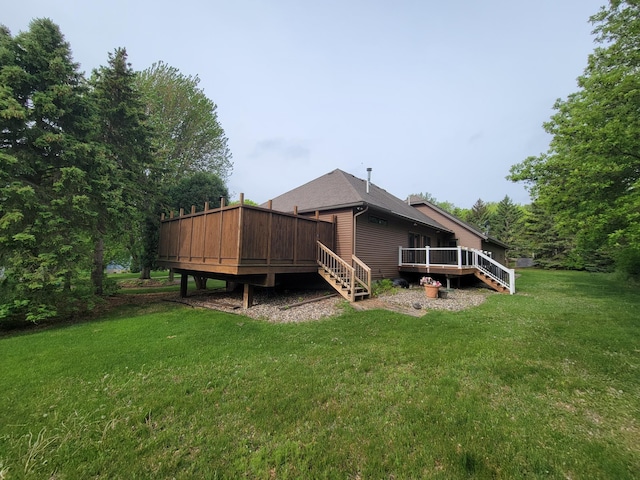 1605 26th St SE, Saint Cloud, MN 56304 - back of house with a wooden deck, a yard, and stairway