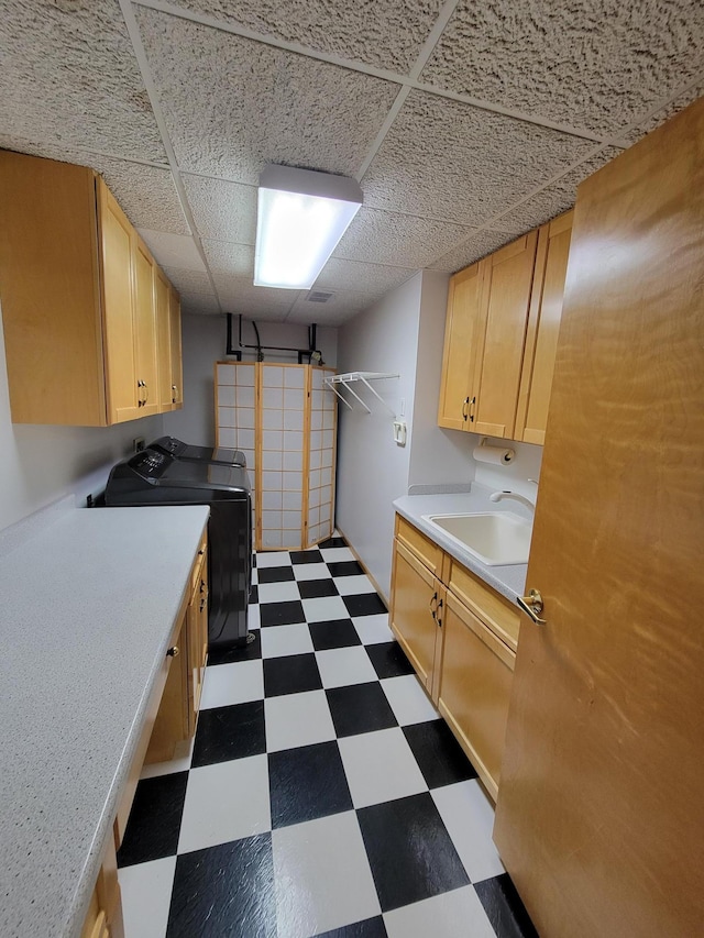 1605 26th St SE, Saint Cloud, MN 56304 - laundry room featuring dark floors, cabinet space, and independent washer and dryer