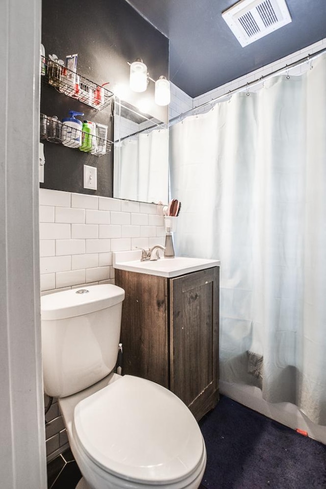 full bathroom with vanity, a shower with curtain, and toilet
