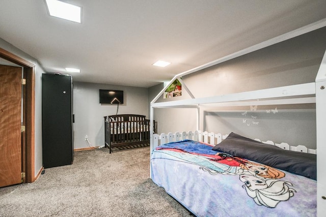 carpeted bedroom featuring baseboards