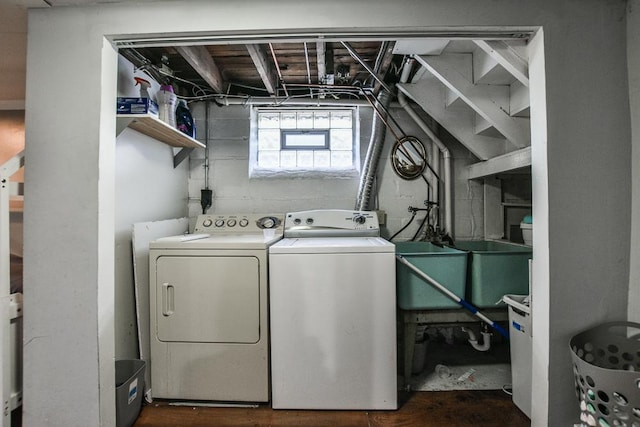 clothes washing area with separate washer and dryer