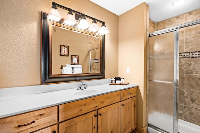 14125-307A Burlington Rd, Two Harbors, MN 55616 - full bathroom with a shower stall, a textured wall, and vanity