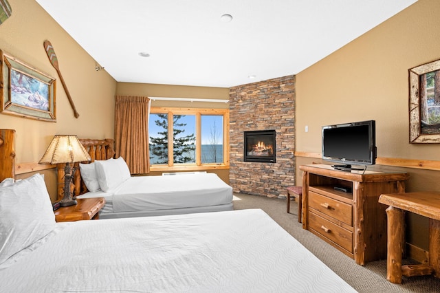 14125-307A Burlington Rd, Two Harbors, MN 55616 - bedroom with carpet floors and a fireplace