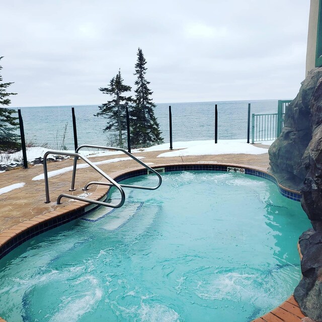 14125-307A Burlington Rd, Two Harbors, MN 55616 - swimming pool featuring a patio and a water view