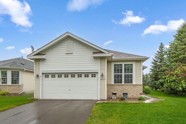 14650 Bloomfield Path, Rosemount, MN 55068 - ranch-style home with asphalt driveway, brick siding, a front yard, and an attached garage