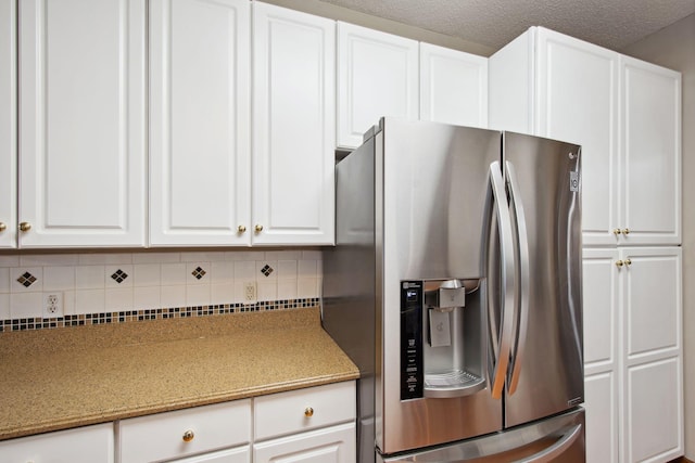14650 Bloomfield Path, Rosemount, MN 55068 - kitchen featuring stainless steel refrigerator with ice dispenser, decorative backsplash, white cabinetry, and light stone countertops