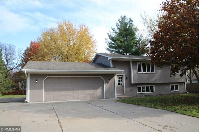 300 Iris Ln SW, Saint Michael, MN 55376 - split level home featuring a garage and concrete driveway