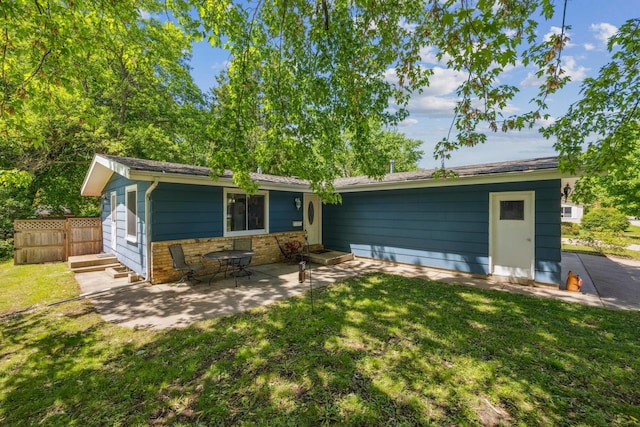 603 2nd Ave NW, Buffalo, MN 55313 - back of property featuring a patio area and brick siding